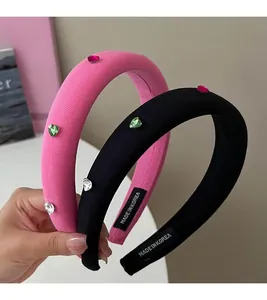 Detail of pink and black sponge headbands with sparkling heart rhinestones