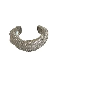 Irregular textured gold lava wrap bangle with open design in vintage luxury style