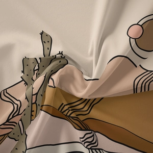 Detail of bohemian tapestry fabric showing abstract cactus prints and woven texture