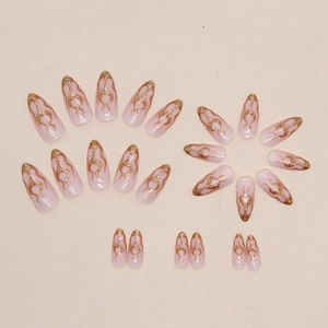 Glitter gold flame almond press-on nails with pale pink translucent base set