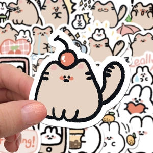 Close-up of cute cartoon cat and bunny matte stickers for laptops and water bottles