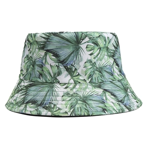 Detail of tropical monstera leaf print on cotton bucket hat with neat stitching