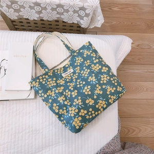 Floral canvas mini tote bag with simple wish label and yellow berry prints on navy blue