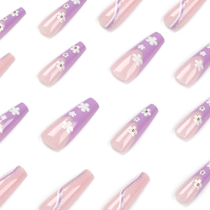 Long ballet purple press on nails with white floral patterns and golden accents