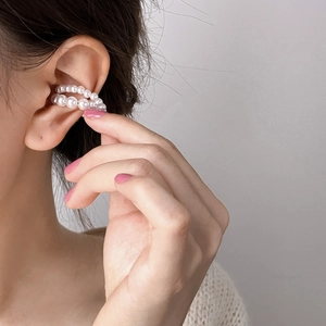 Elegant double-layer white pearl ear cuff for women on model in Hepburn French style