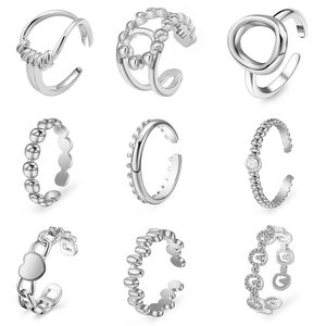 9-piece set of silver adjustable open rings and ear cuffs with heart and bead designs