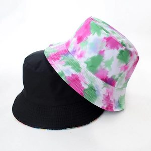Close-up of double-sided tie-dye bucket hat showing cotton canvas texture and stitching