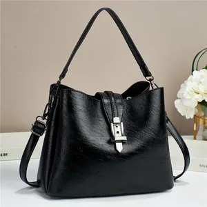 Retro black leather bucket bag with silver lock and textured pebble finish