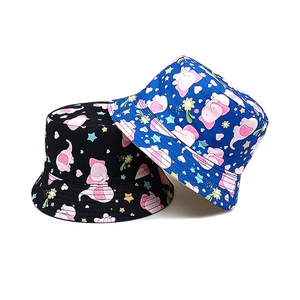 Kids reversible bucket hats with cartoon elephant pattern in black and bright blue colors