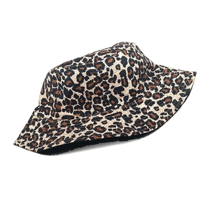 Close-up of leopard print bucket hat showing detailed canvas texture and animal pattern