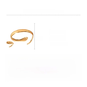 Detail view of gold snake cuff bracelet in iron featuring scaled texture and 6cm size