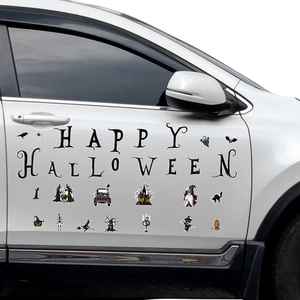 Detail of Halloween gnome and skull magnets applied on a white car door for holiday decor