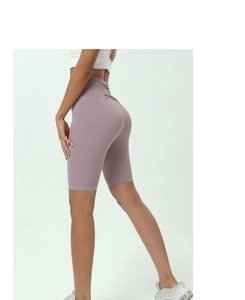 Detail view of high-waist yoga shorts featuring a criss-cross lace-up back design