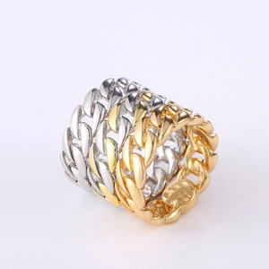 Detailed view of two-tone gold and silver Cuban link chain ring with polished finish