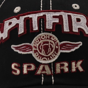 Close-up of SPARK letter embroidery and Spitfire logo on vintage black cotton baseball cap
