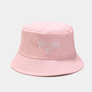 Close-up of pink cotton bucket hat with white New York embroidery and stitched brim