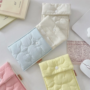Detailed view of quilted cotton sanitary pouch set in assorted pastel candy colors