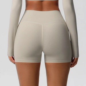 Detail view of high waist yoga shorts with seamless contouring for a peach lifting effect