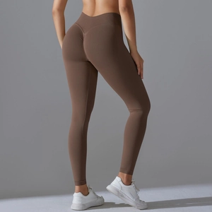 Detail of high-waist seamless brown yoga leggings featuring scrunch butt lifting design