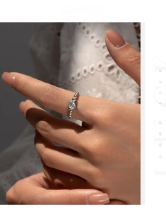 Close-up of S925 silver beaded ring featuring a sparkling moissanite stone on lace