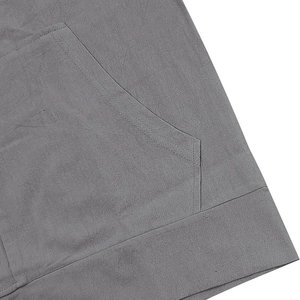 Detailed close-up of stitching on grey linen-blend pocket and hem of casual set