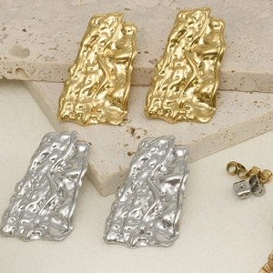 Textured 304 stainless steel earrings with irregular 18k gold and silver molten finish