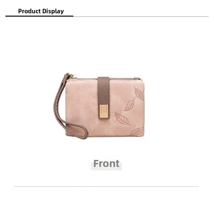 Front view of pink minimalist coin purse with leaf pattern and gold metal buckle detail