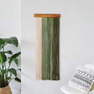 Bohemian woven wall hanging with wooden shelf and green tassels for home decor