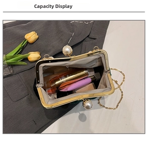 Green velvet pearl evening bag interior capacity showing small cosmetics and gold chain