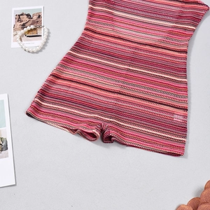 Close-up of vibrant striped crochet knit romper with colorful horizontal pattern