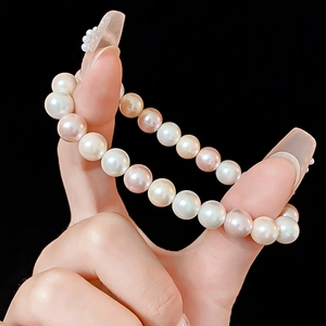 Detailed close-up of premium 8-9mm white and lavender pearls with high luster shine