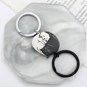 Cute black and white cat puzzle keychains for couples in minimalist stainless steel