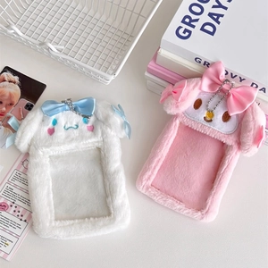 Detail of plush bunny photocard holders with cute bows and soft furry texture