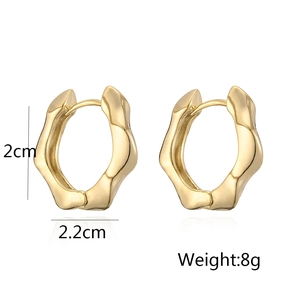 Detailed view of gold-plated metallic earrings measuring 2cm by 2.2cm and weighing 8g