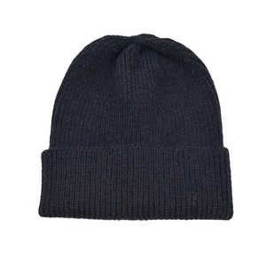 Detailed close-up of black ribbed knit beanie showing warm textured weave fabric