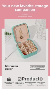 Detail showing mint green leather jewelry box with multi-slot storage for rings and necklaces