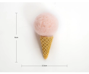 Detailed view of pink wool felt ice cream ornament with dimensions 6cm by 3.5cm