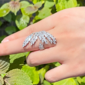 Detailed view of silver angel wing ring with sparkling marquise-cut zircon stones