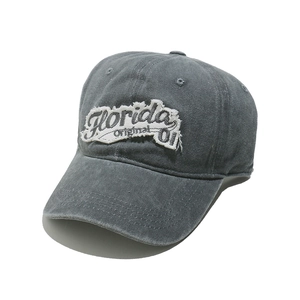 Detail of vintage washed gray baseball cap featuring frayed edges and Florida embroidery