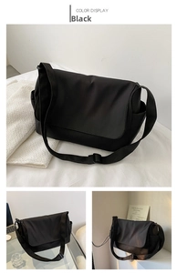 Detailed views of a black oxford messenger bag with adjustable strap and side pocket