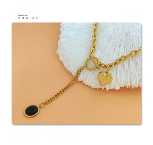 Detail of 18k gold plated surgical titanium steel heart necklace with toggle clasp