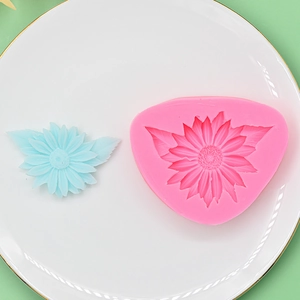 Sunflower and leaf silicone mold for fondant DIY and resin crafts in a ceramic dish
