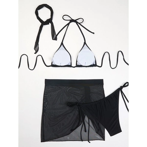 Flat lay detail of black four-piece mesh bikini set with neck scarf and skirt