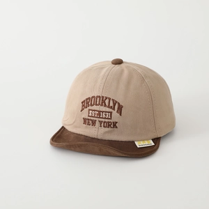 Detail of embroidered vintage Brooklyn New York text and logo on canvas baby cap