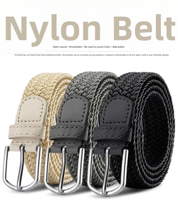 Close-up of three braided elastic nylon belts in beige, grey, and black colors