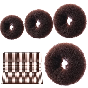 Detail of dark brown foam donut hair bun makers and U-shaped metal pins set for styling