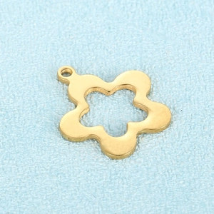Macro view of gold five-petal flower pendant with hollow star detail for DIY jewelry