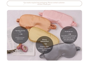 Detailed close-up of soft satin eye masks in pink, bronze, gold and grey on a desk