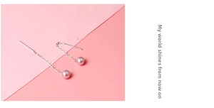 Detail view of S925 silver long drop earrings with shiny pink freshwater pearls