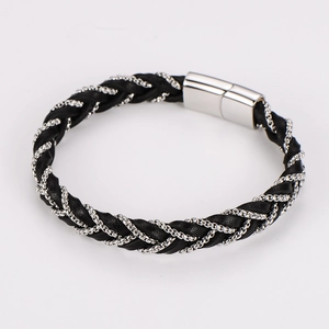 Detail of black braided leather bracelet with silver metal chain and magnetic clasp